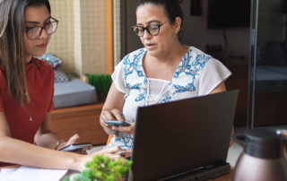 An image of a parent discussing budgeting with a student.